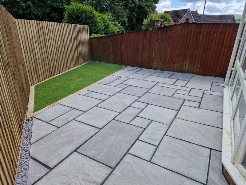 Patio with artificial grass strip