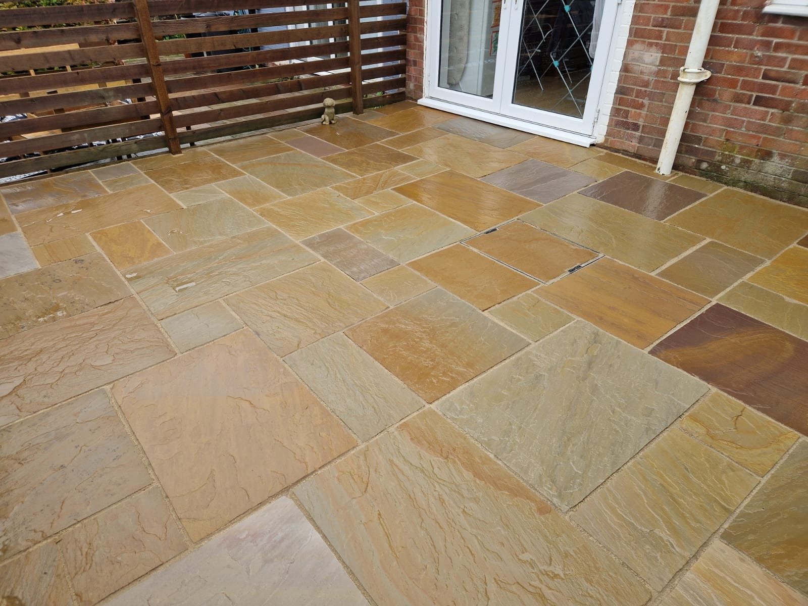 Golden sandstone patio outside patio doors