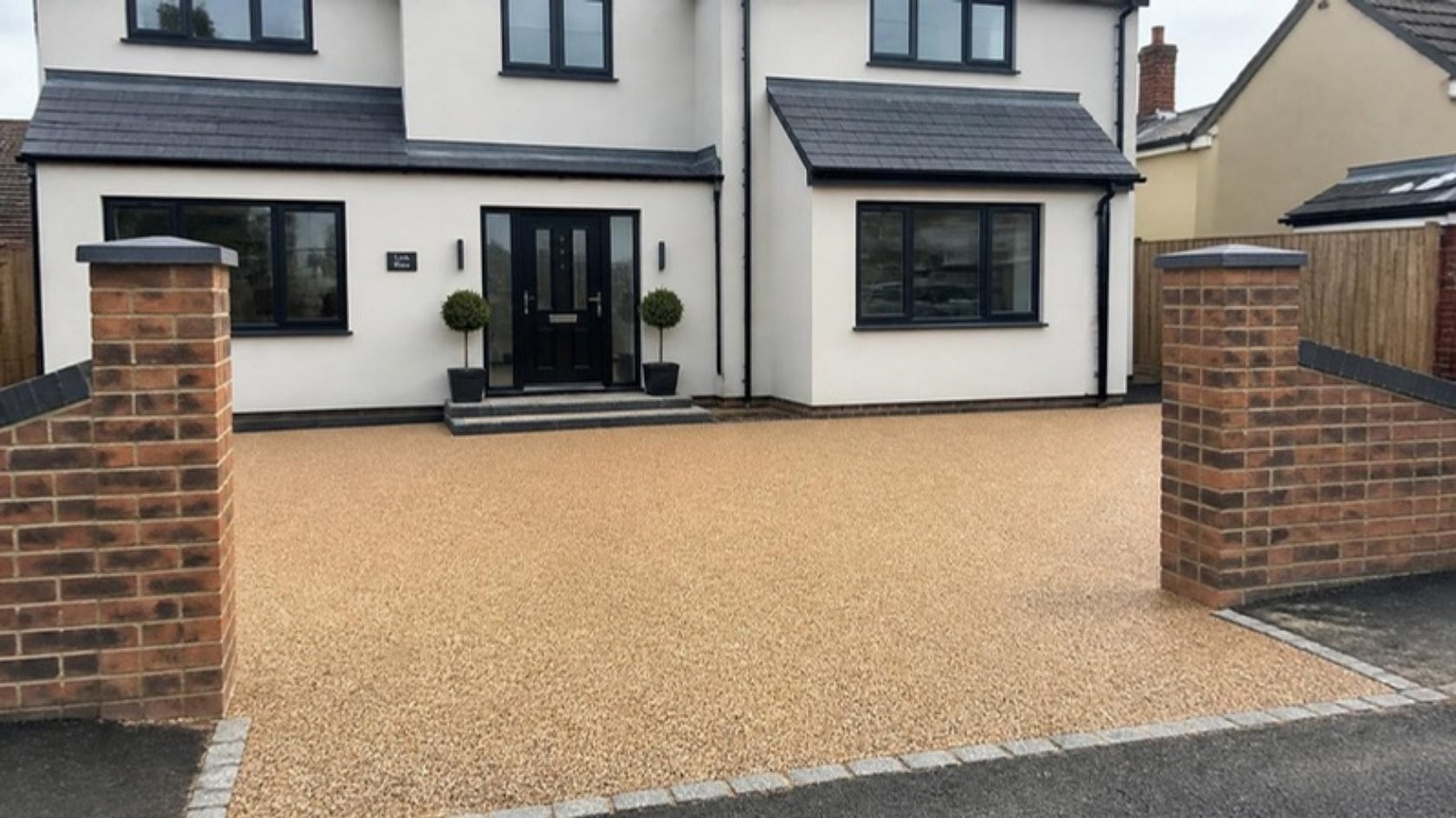 Resin bound driveway in front of a modern detached house